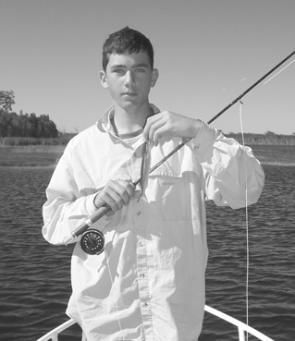 The author’s eldest son James, with his first fly-caught fish. An important milestone in any young angler’s career.